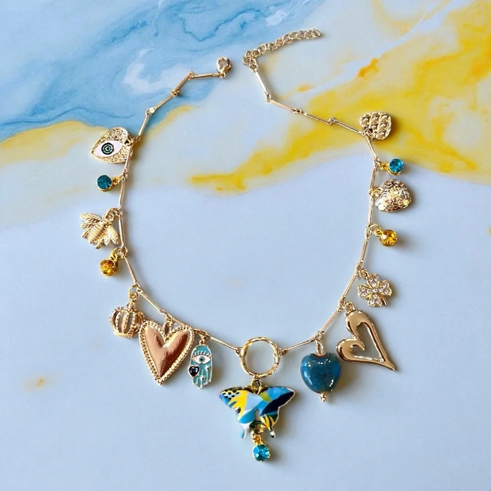 Unique and Gorgeous Gold toned Necklace with Varying Blue and Yellow Charms